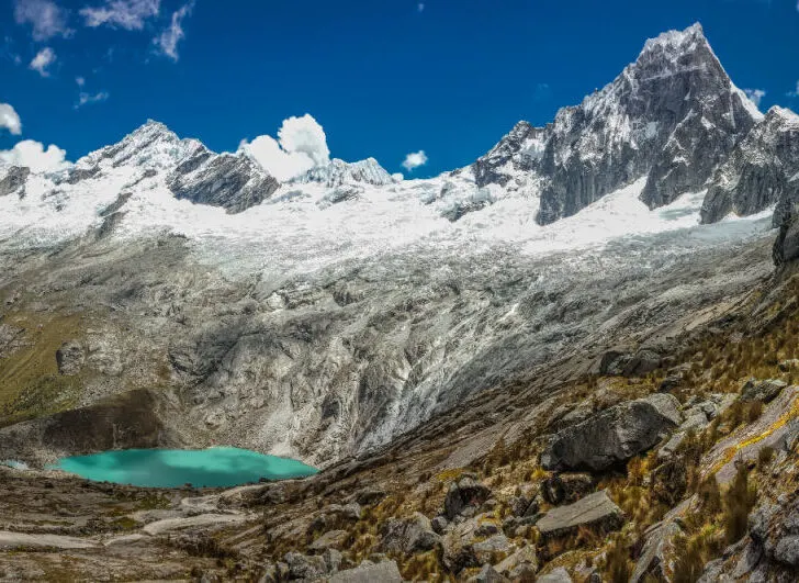 The breathtaking view from Punta Union, the highest point of the Santa Cruz trek, overlooking a bright blue lake.