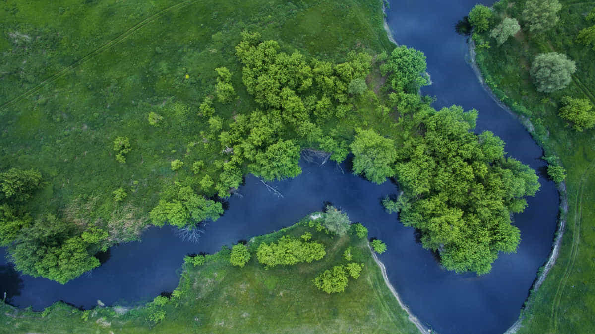 An image of a winding river from above weaving its way through the Amazon
