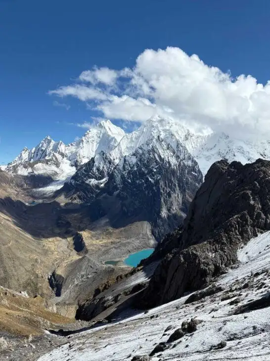 Views as seen during the Cordillera Huayhuash hike, featuring mountains and bright blue lakes